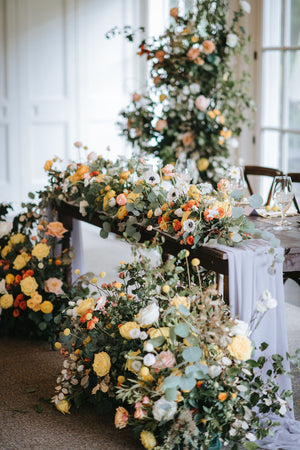 Lush and vibrant flower garland, embodying the shimmering allure of the Sunshine Coast and seamlessly complementing sophisticated Toronto nuptials