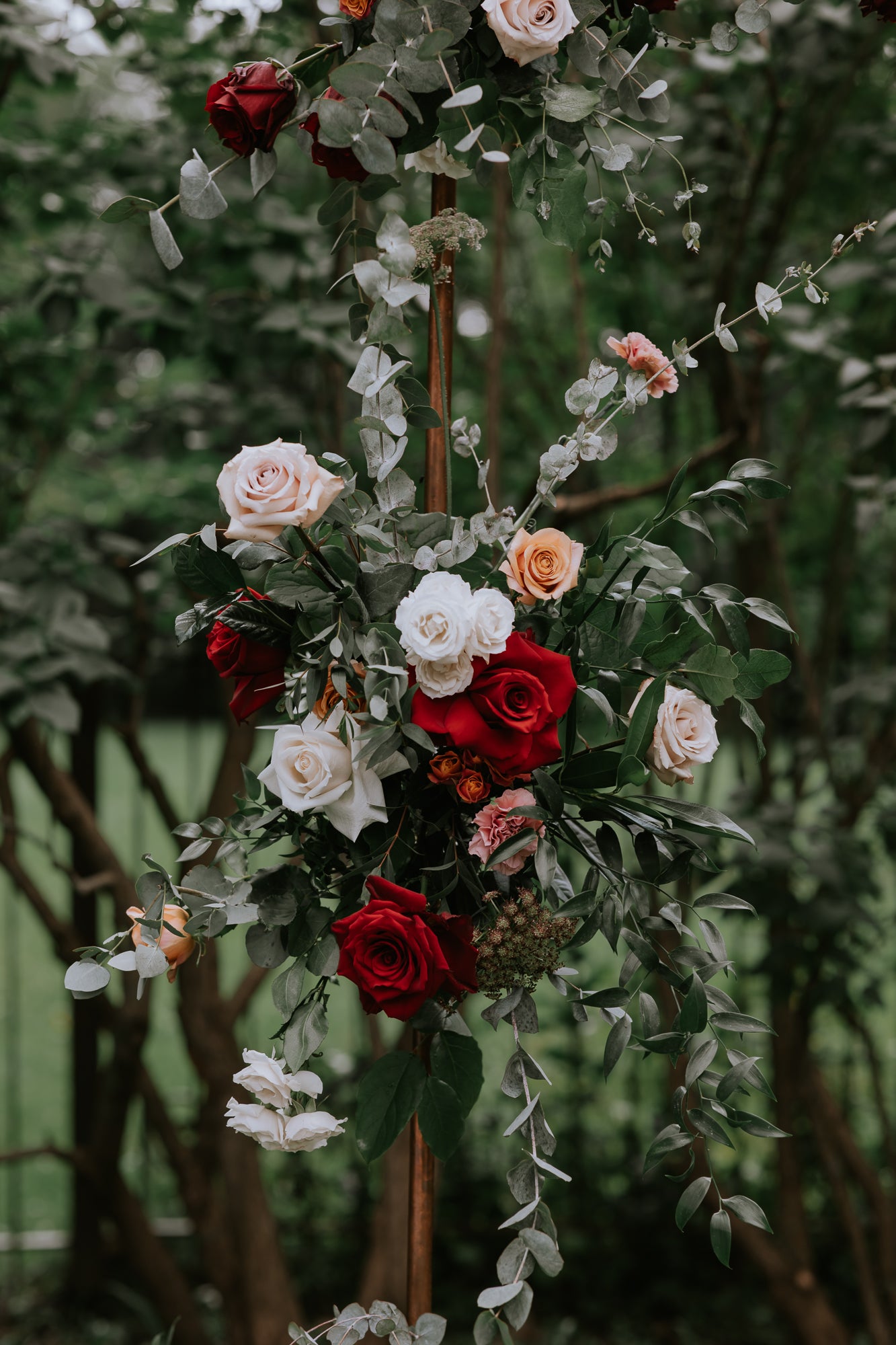 Vintage-Inspired Corsage with Deep Wine and Toffee Florals for Sophisticated Celebrations