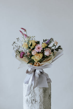 Large Vibrant De Novo Bouquet: Bold Roses and Seasonal Blossoms Enveloped in Layered Woven Wrap